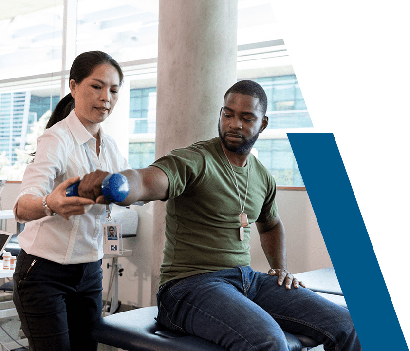 occupational therapist helping patient with arm exercises