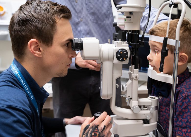 a man looking at a child's eyes