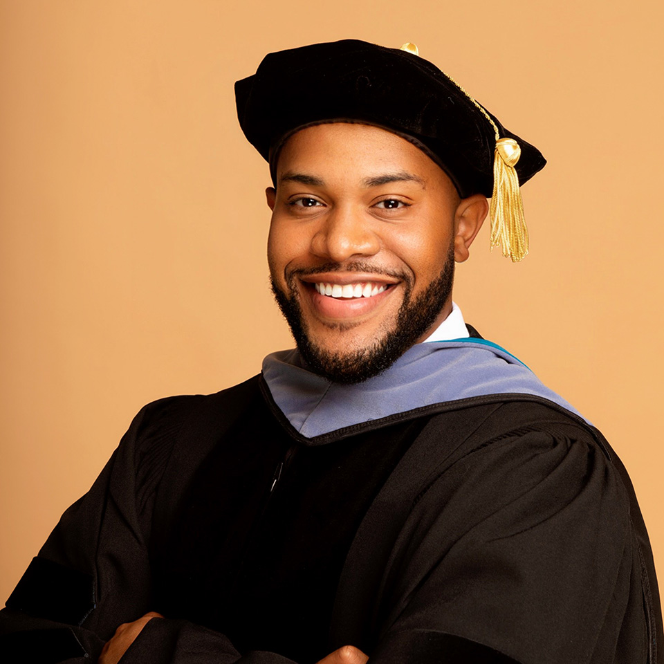 Graduation attire with academic regalia.