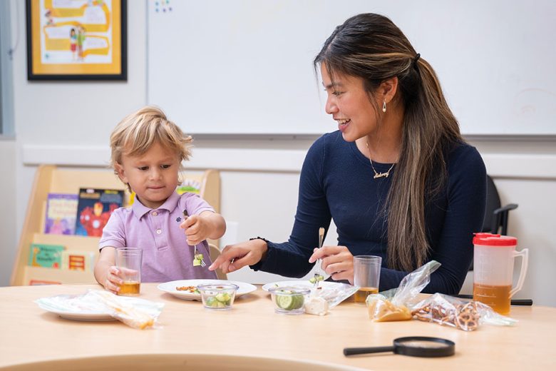 SLP-L student helping a child