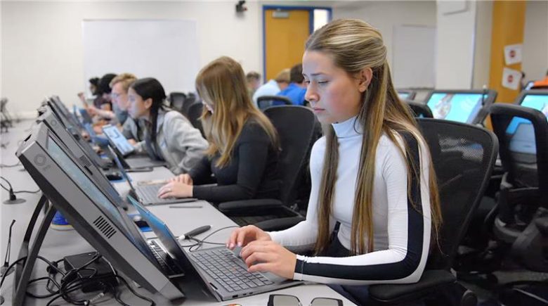 Students working on computers in classroom