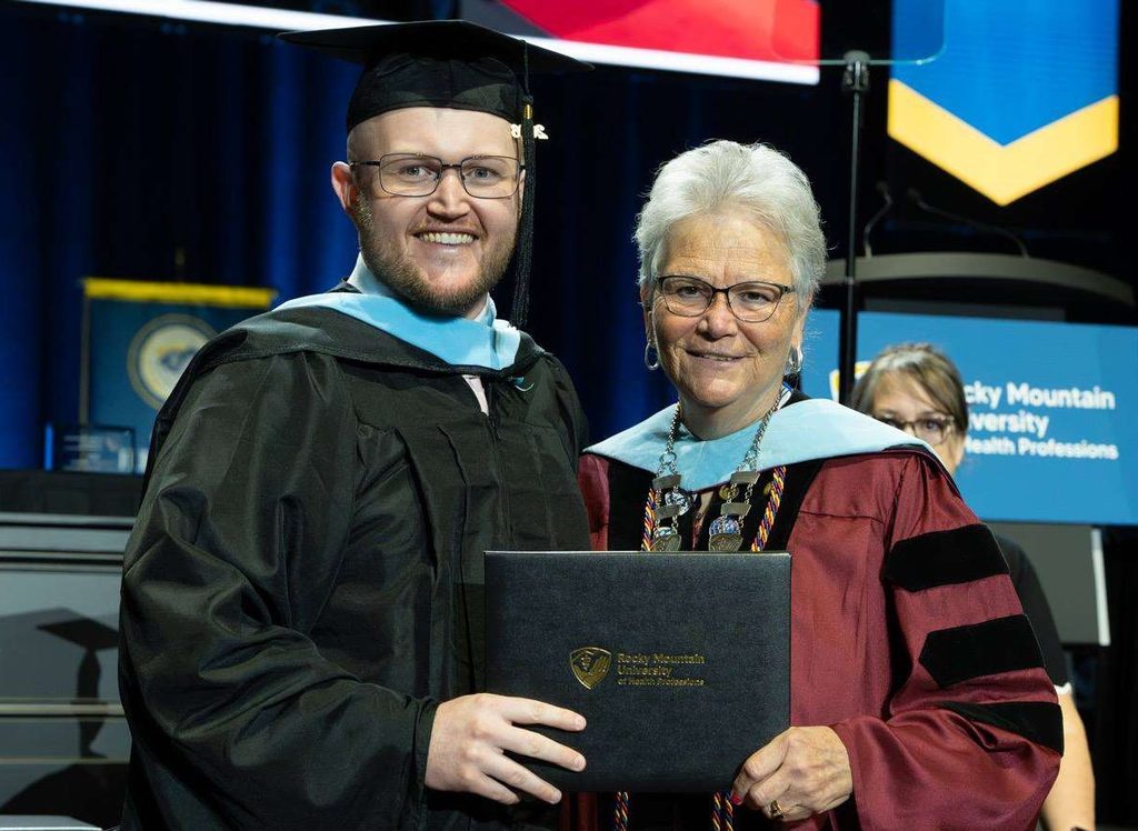 Man and woman smileat graduation