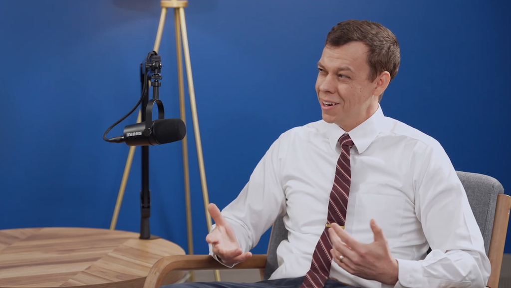 A man gestures while speaking